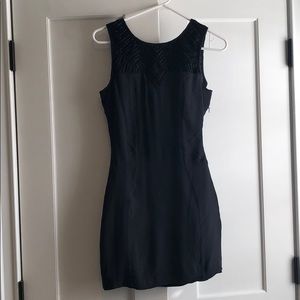 Sleeveless black dress with beaded embellishment